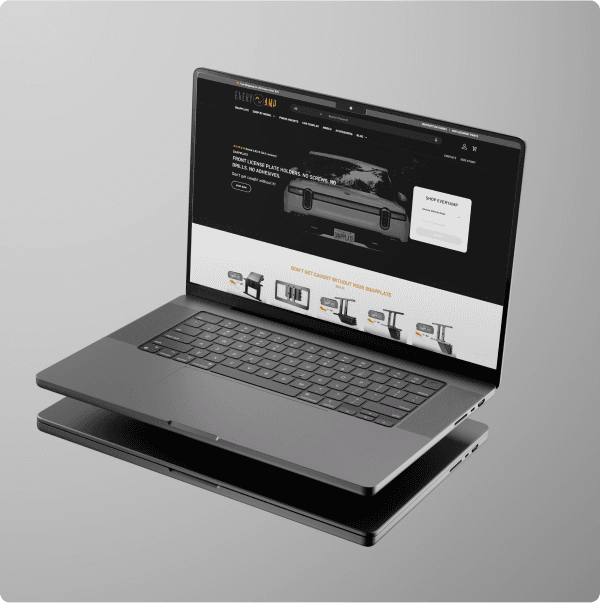 The EveryAmp homepage shown on a floating laptop