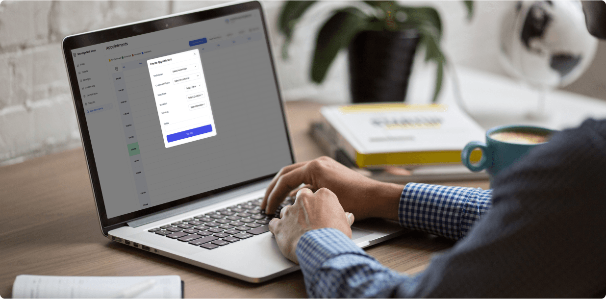 Create-appointment form open over the salon calendar on a laptop