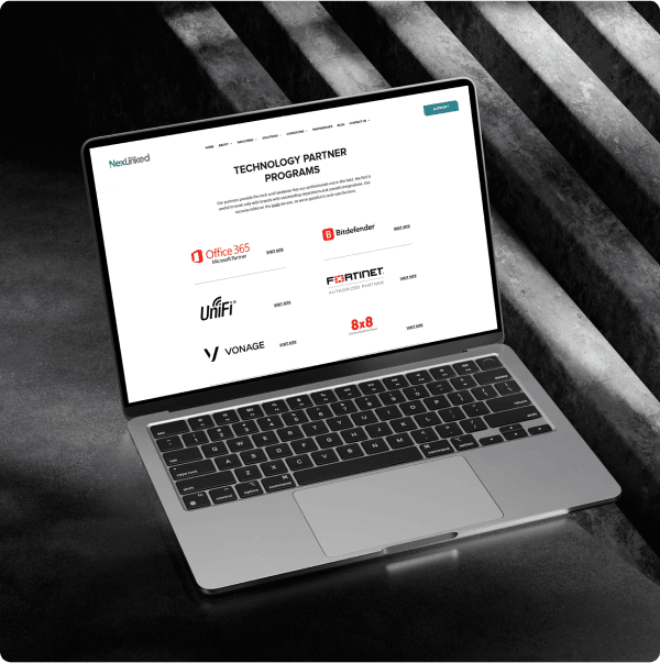 The technology partner programs page shown on an angled laptop